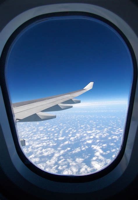 window hublot airplane|a view of the wing of an airplane through a window .